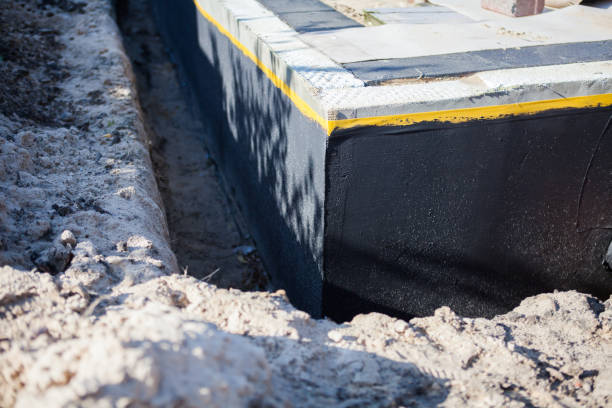 Professional Waterproofing technician working in Marshall, MI